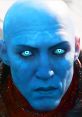 Close-up of Zavala, featuring distinctive blue skin and glowing eyes, conveying strength and determination in a sci-fi setting.