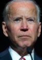 Joe Biden gives a serious address, showcasing determination and focus during a speech at a public event.