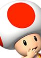 Toad from Mario Kart Arcade GP DX, smiling and gesturing playfully, showcases his iconic red and white spotted cap.