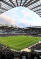 Vibrant stadium filled with fans watching an exciting soccer match under a dramatic sky. Perfect for sports enthusiasts.