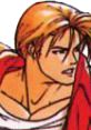 Terry Bogard from King of Fighters 94 showing intense focus in his iconic red jacket and signature hairstyle.