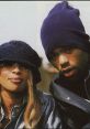 Mary J. Blige and Method Man pose together in stylish hats, embodying hip-hop's vibrant culture and collaboration spirit.