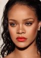 Rihanna showcases a stunning beauty look with bold red lips and glowing skin, captivating fans with her iconic style.