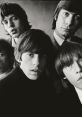 Classic black-and-white portrait of The Rolling Stones showcasing their iconic style and charisma during the 1960s.