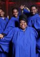 Joyful gospel choir members in blue robes, celebrating music and community with vibrant smiles and enthusiasm.