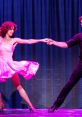 Passionate dance duet in vibrant costumes, capturing the spirit of "Dirty Dancing" and timeless romance on stage.