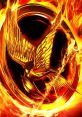 Golden Mockingjay emblem surrounded by flames, symbolizing rebellion and hope in The Hunger Games series.