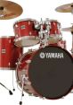 Yamaha red drum set with cymbals, featuring sparkling chrome hardware, perfect for drumming enthusiasts and musicians.