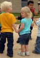 Children ages 5-10 play together outdoors, holding hands and enjoying a fun day of friendship and laughter.