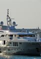 Luxury yacht with sleek design docked near marina, showcasing modern features and premium craftsmanship. Ships’ sirens in view.