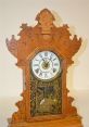 Vintage wooden clock with intricate designs, showcasing craftsmanship and the passage of time at Oxford College.