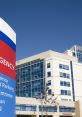 Emergency entrance of a modern hospital with clear signage and a blue sky backdrop for effective wayfinding and accessibility.