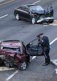 Police officer investigates a severe car crash with significant damage to vehicles on the highway, highlighting road safety issues.