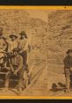 Historic photograph of workers, including Chinese laborers, on a railway track, showcasing the Chinaman Alternate theme.