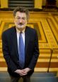 Professional lawyer with glasses standing confidently on stairs, showcasing a formal attire and serious demeanor.