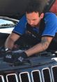 Skilled auto technician performing detailed vehicle inspection and maintenance at Auto Repair FX shop.