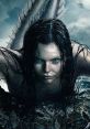 Mysterious siren with striking blue eyes and a scaled tail emerging from turbulent waters, captivating and enchanting.