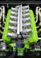 Detailed view of a vibrant green V12 engine with polished intake manifold and dual throttle bodies showcasing performance engineering.