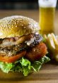 Juicy hamburger with sesame seed bun, fresh lettuce, tomatoes, crispy bacon, served with fries and a cold beer.