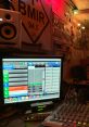 Control room setup featuring BMIR 94.5 broadcast software and audio equipment, with ambient lighting and vintage decor.