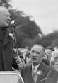 Winston Churchill delivering a powerful speech, captivating the audience amid a historic gathering.