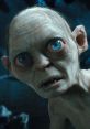 Close-up of Gollum-Smeagol, showcasing his large blue eyes and distinct features in a dark, mysterious setting.