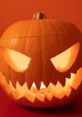 Carved Halloween pumpkin with glowing eyes and mouth, perfect for spooky celebrations and Halloween songs ambiance.