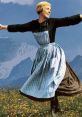 Joyful woman in traditional alpine dress dancing in a scenic mountain landscape, perfect for inspiration and creativity.