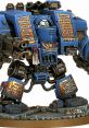 Detailed Warhammer Dreadnought model featuring blue armor and intricate inscriptions, showcasing its impressive design and craftsmanship.