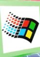 Retro Windows logo on a green background, showcasing vibrant colors and pixelated design, ideal for Windows meme bord content.