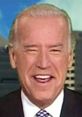 Joe Biden smiling broadly during an interview, showcasing his lighthearted and humorous side in politics.