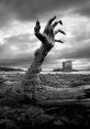 A haunting landscape featuring a gnarled hand emerging from the ground, set against a dark, ominous sky.