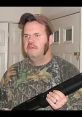 Man in camouflage holding a shotgun, dressed in a cap, embodying Birmingham Redneck culture and Southern outdoors lifestyle.