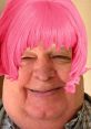 Cheerful man with a pink wig, showcasing a playful and humorous expression, perfect for a fun Cock Inspector theme.