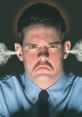 Angry man with a mustache, fuming and tense, showcasing visible frustration and intense emotions in a dramatic setting.