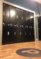 Lockers in a modern facility with a logo, highlighting the organized space at PressBox for secure storage.