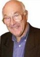 Murray Walker smiling, known for his iconic commentary and memorable Murrayisms in motorsport broadcasting.