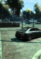 Black luxury car navigating a street in GTA IV, showcasing detailed urban scenery and natural lighting.