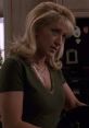 Carmela Soprano in a green top, displaying her signature style and emotional depth from the iconic series "The Sopranos.