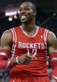 Dwight Howard celebrating a play in his Houston Rockets jersey, showcasing excitement in a dynamic basketball moment.