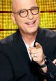 Host Howie Mandel smiling and pointing, promoting excitement for the game show "Deal or No Deal.