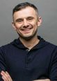 Gary Vaynerchuk smiling confidently in a navy hoodie, showcasing his approachable and inspiring personality for entrepreneurs.