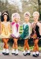 Irish dancers in vibrant costumes pose outdoors, showcasing traditional dance styles with intricate detailing and unique hairstyles.