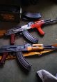 Two Akm rifles with wooden and synthetic grips, surrounded by ammunition boxes and magazines on a green carpet.