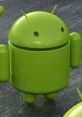 Green Android mascot with antennae standing on a textured surface, symbolizing the Android operating system.