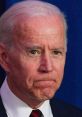 Joe Biden displaying a serious expression during a public speaking engagement, highlighting a moment of contemplation.