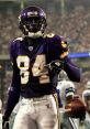 Vikings player celebrating with a football during an NFL game, wearing purple uniform, focused on victory and teamwork.