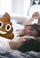 Couple sharing a laugh in bed, humorously featuring a poop emoji, highlighting the lighter side of relationships and farts.