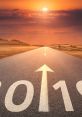 Sunset over a road marked with "2019," symbolizing new beginnings and journeys ahead in the year.