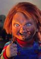 Chucky doll with striking blue eyes and a wicked grin, holding a knife, embodies horror icon status from the franchise.